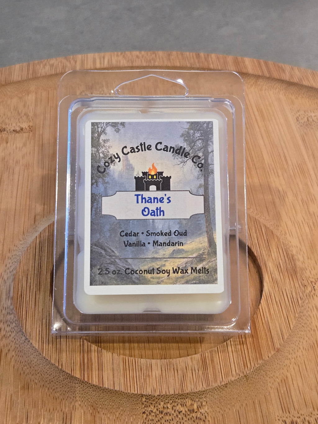 Wax Melts labeled "Thanes Oath" on a textured wooden surface.