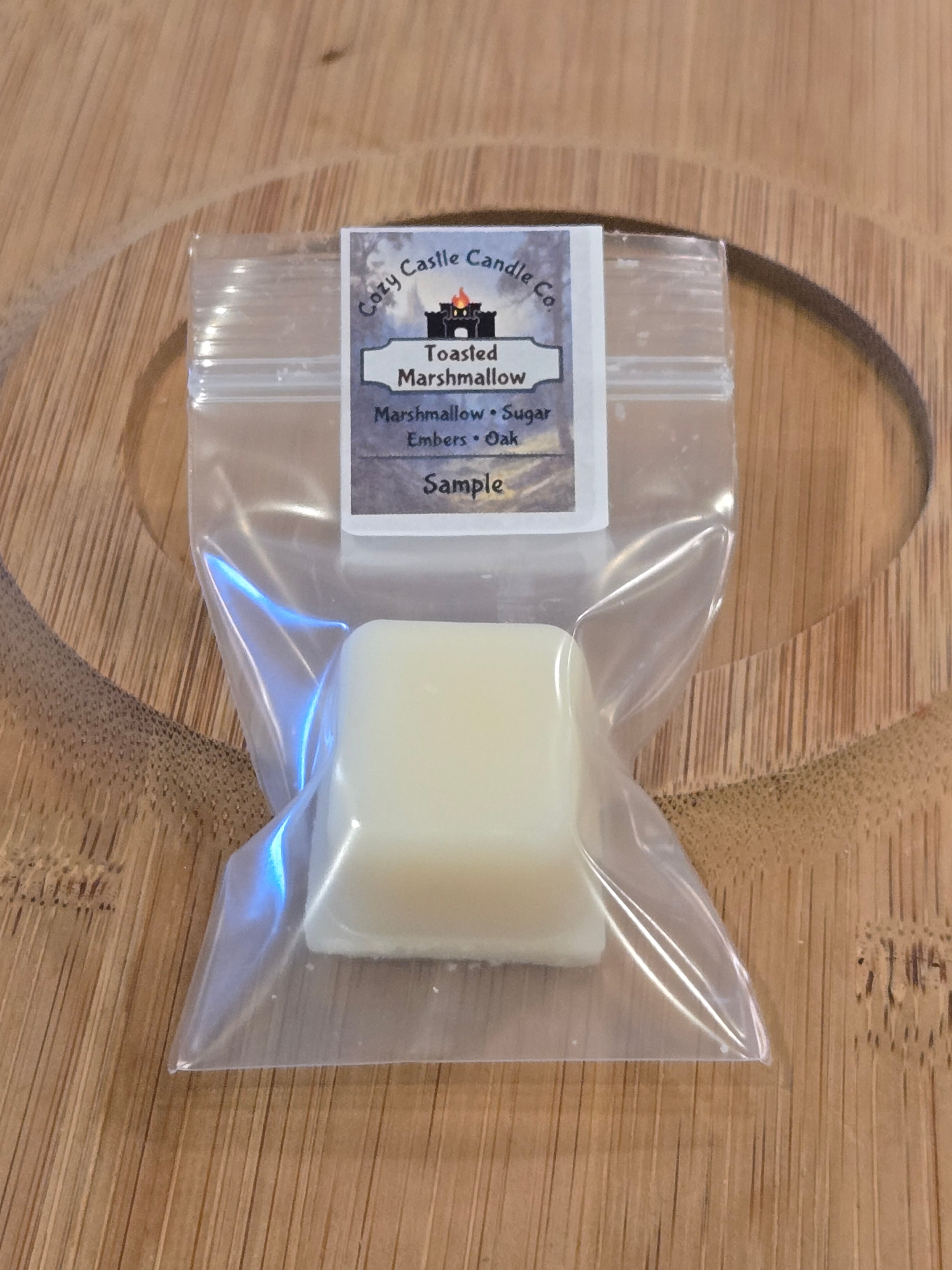 Small wax melt in a clear plastic bag with a label on a wooden surface
